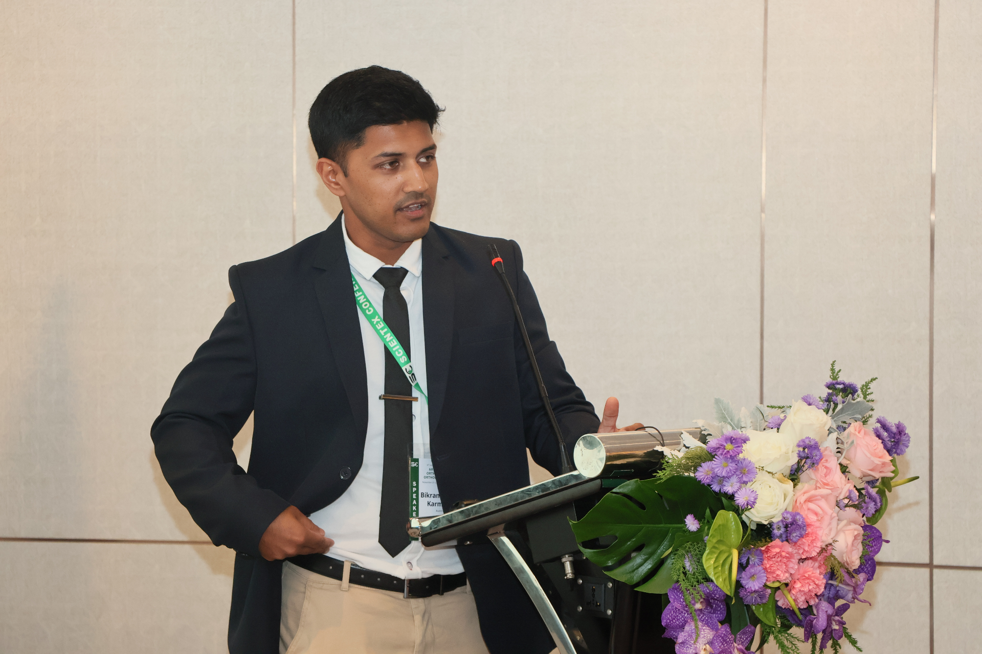 Dr Bikram Karmakar presenting at a sports medicine conference